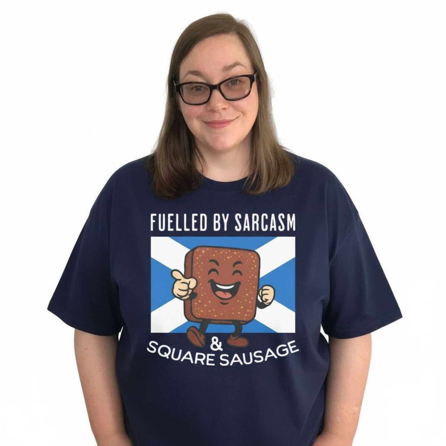 Person Wearing a Navy Scottish T-Shirt featuring the slogan "Fuelled By Sarcasm And Square Sausage" by Sarcastic Scots