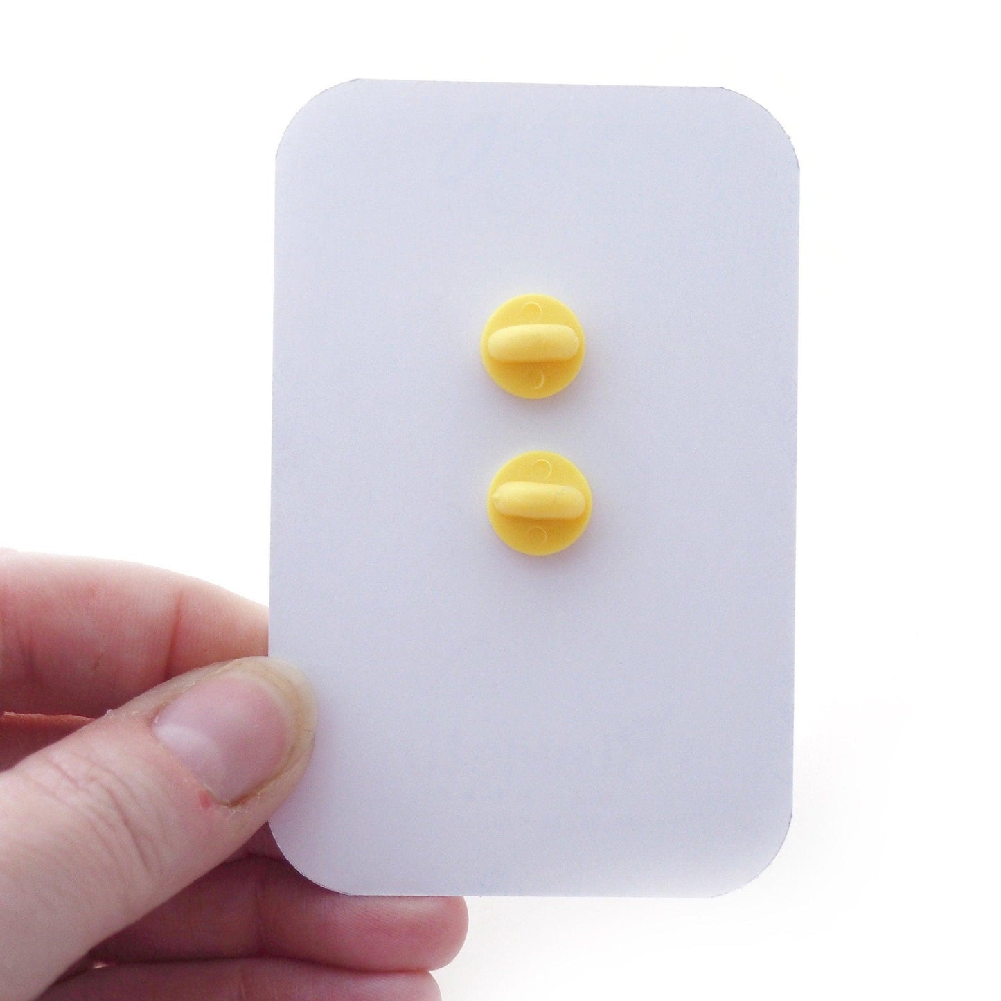 2 Rubber Clutches on the back of a Backing Card