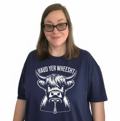 Person Wearing a Navy Scottish T-Shirt featuring the slogan "Haud Yer Wheesht" by Sarcastic Scots