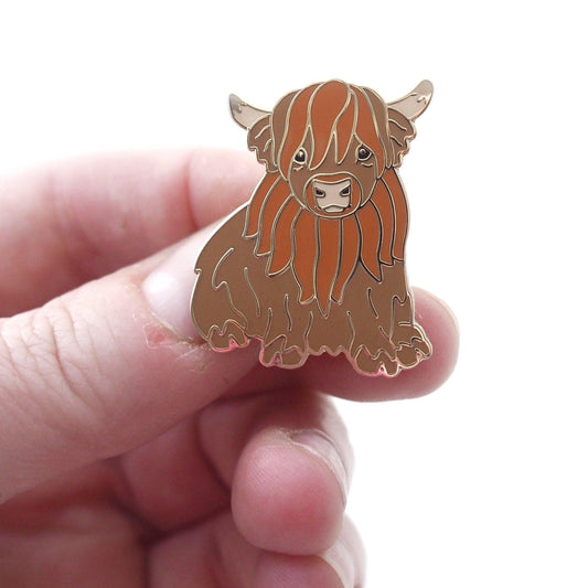 Cute Highland Cow Enamel Pin in a Sitting Position